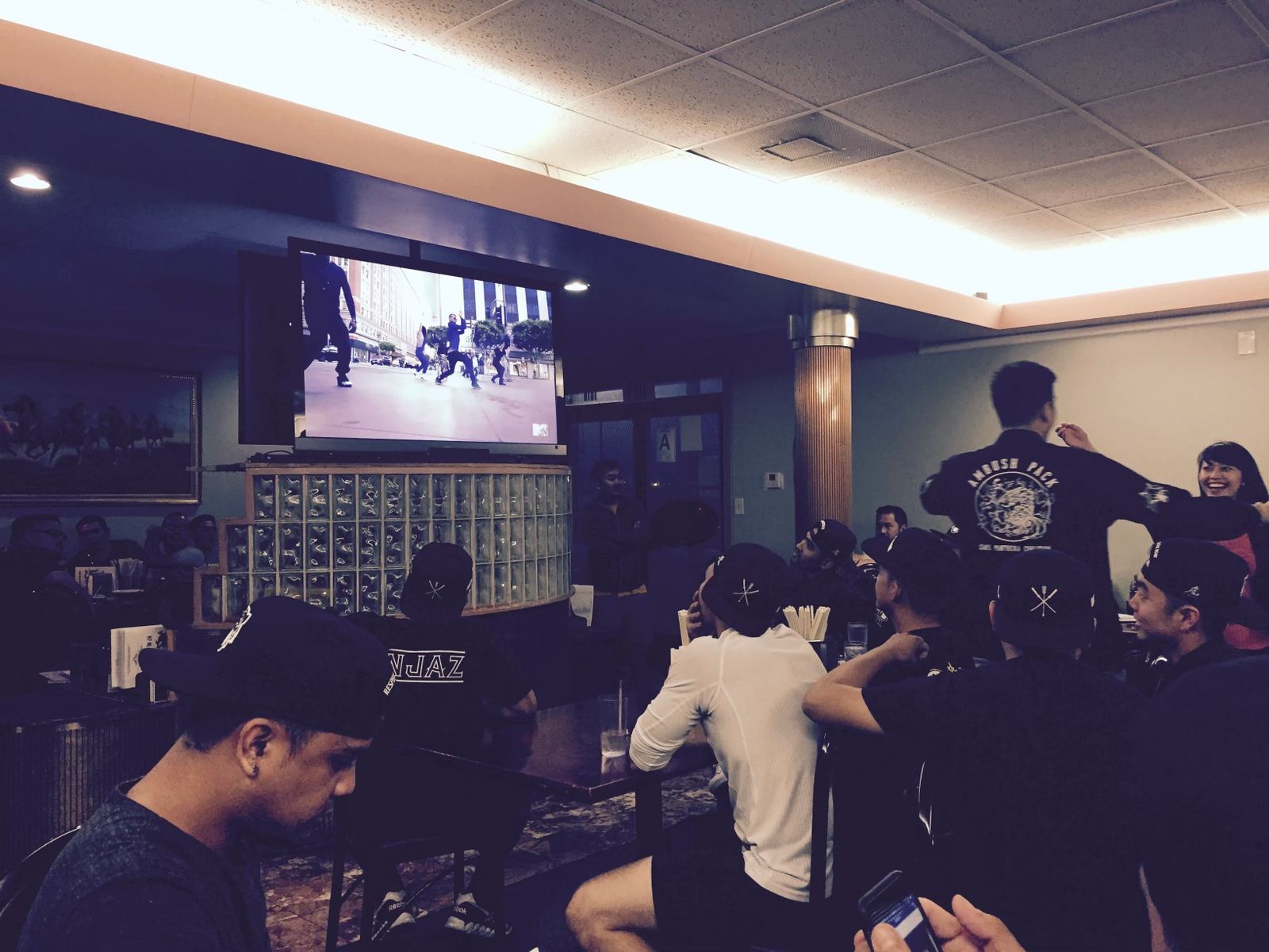 The crew watching their first episode on a big screen