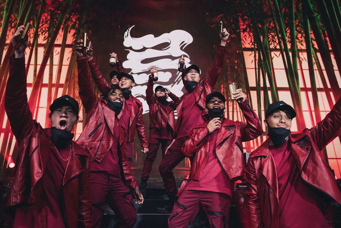 The crew in red suits and masks on the Coachella main stage, the Kinjaz mark behind them